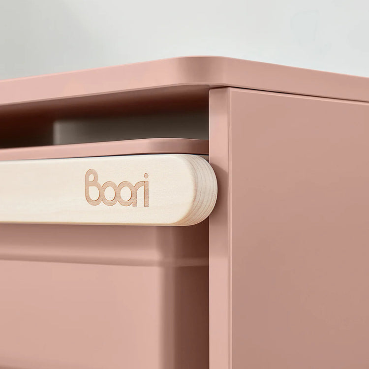 Close-up of a pink storage unit with 'boori' branding on a light gray background