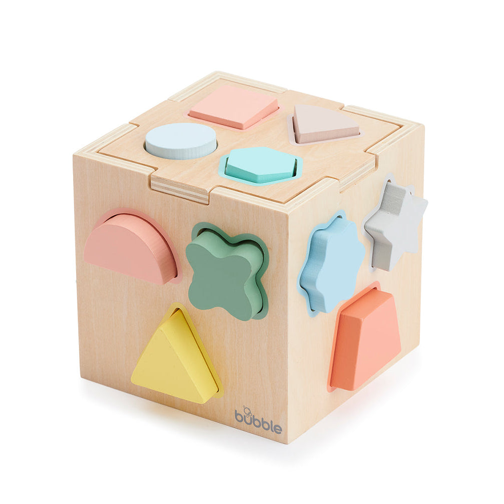 Wooden shape sorting cube with colorful shapes on a white background