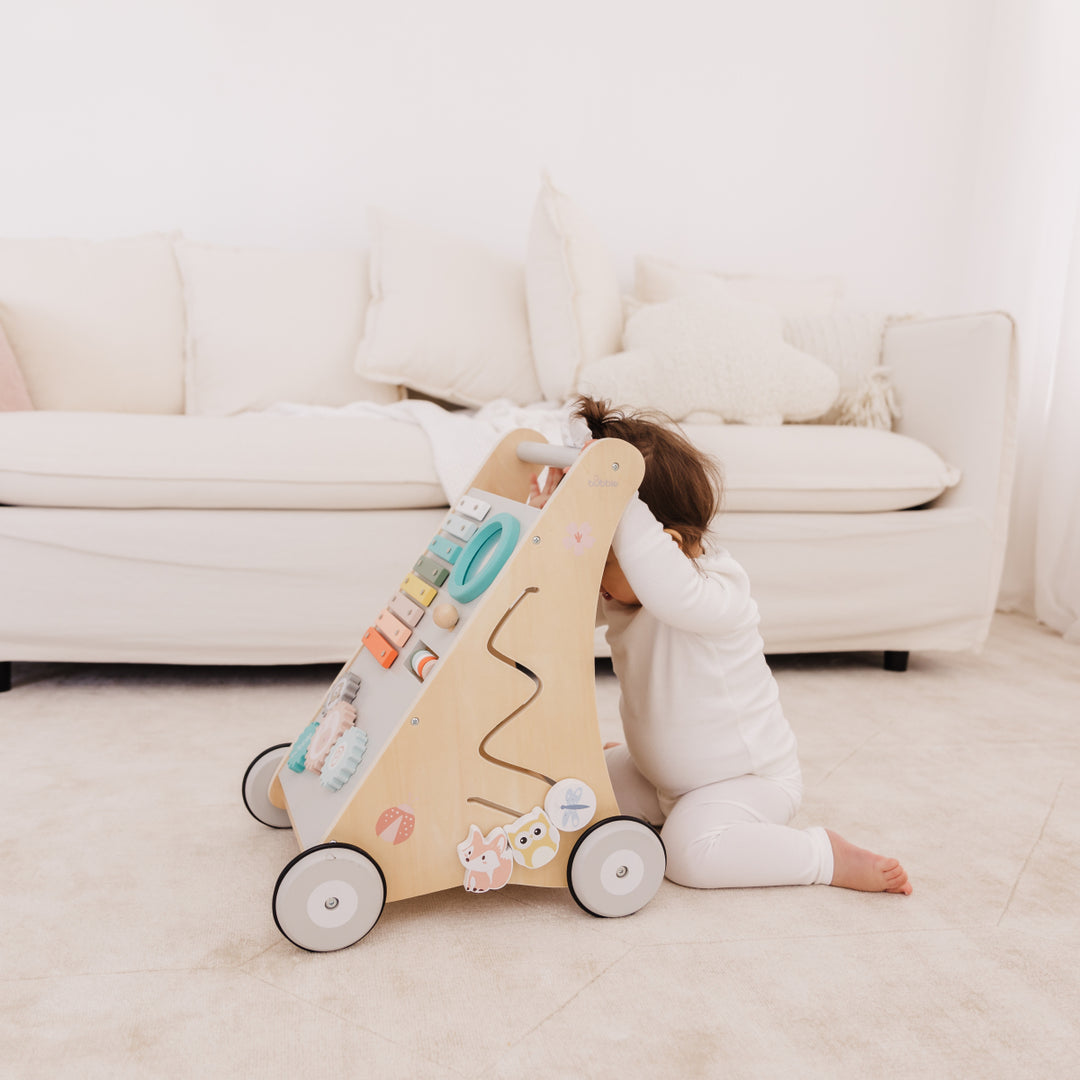 Child playing with a toy in a living room