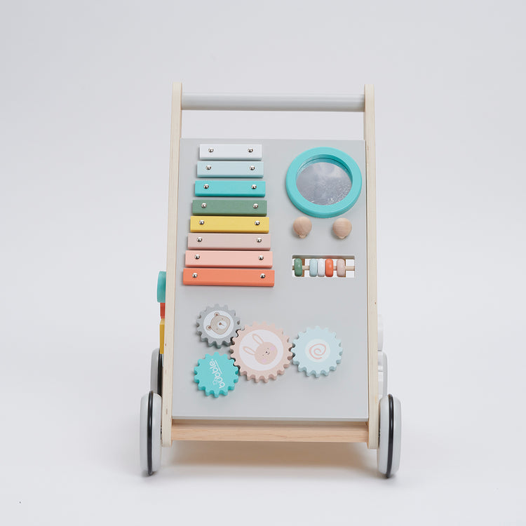 Children's activity center with colorful gears, xylophone, and mirror on a white background