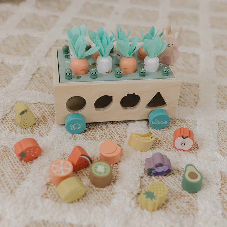 Wooden shape sorting toy with colorful geometric shapes on a textured surface