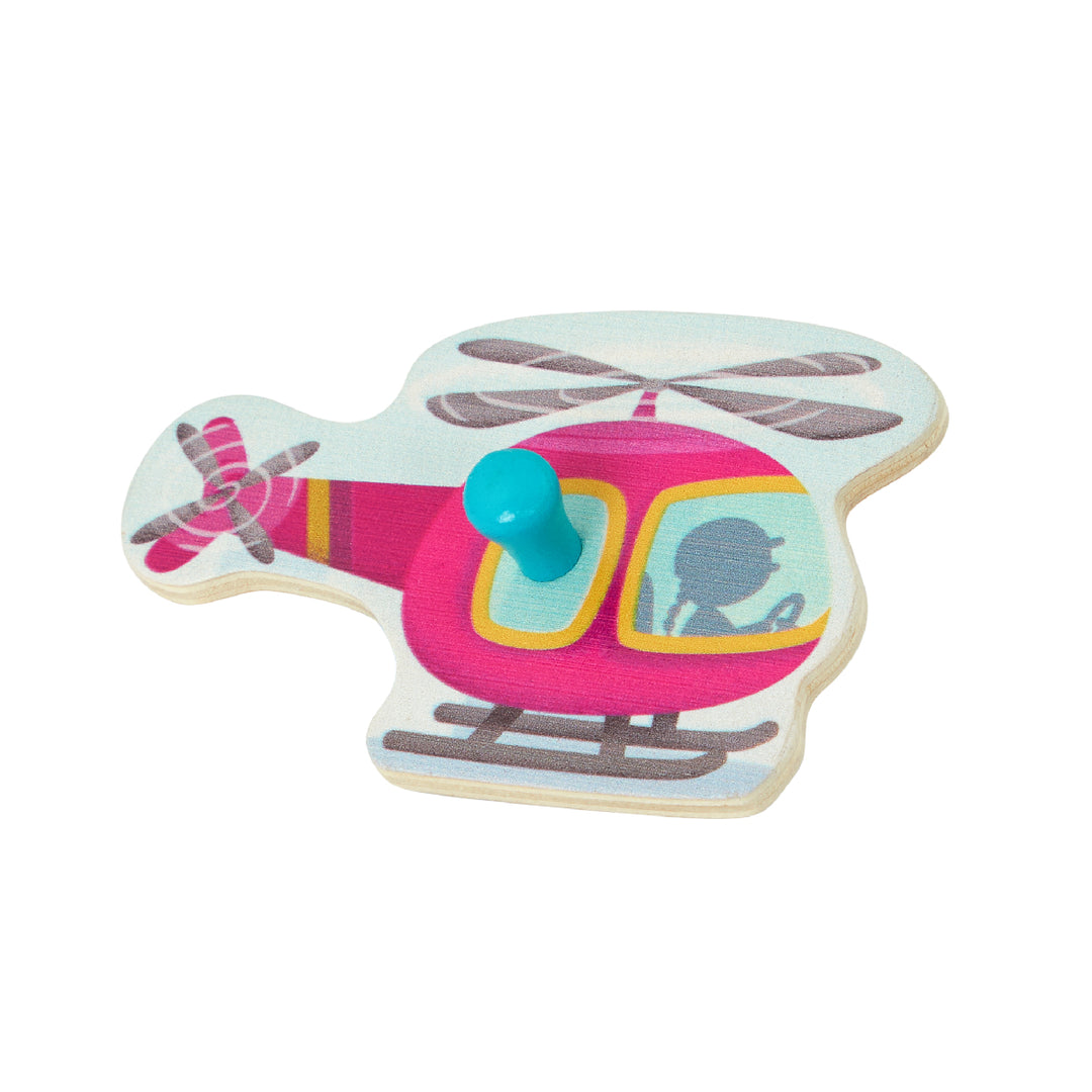 Cookie-shaped toy helicopter with pink body and blue nose on a white background