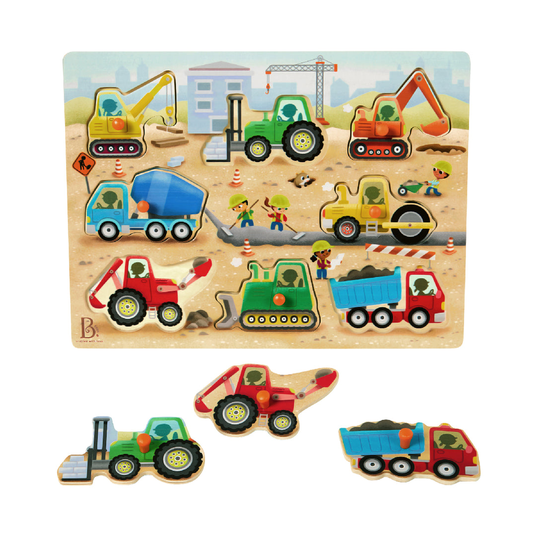 Wooden puzzle with colorful construction vehicle figures on a sandy background