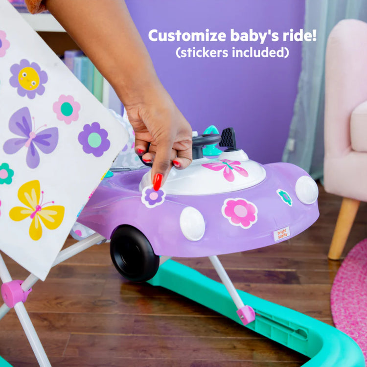 Purple toy walker with floral design, held by a hand, with text 'Customize baby's ride! (stickers included)'