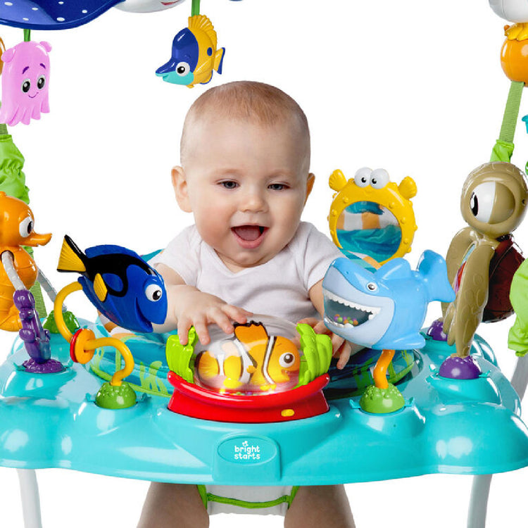 Baby playing with an undersea themed activity center