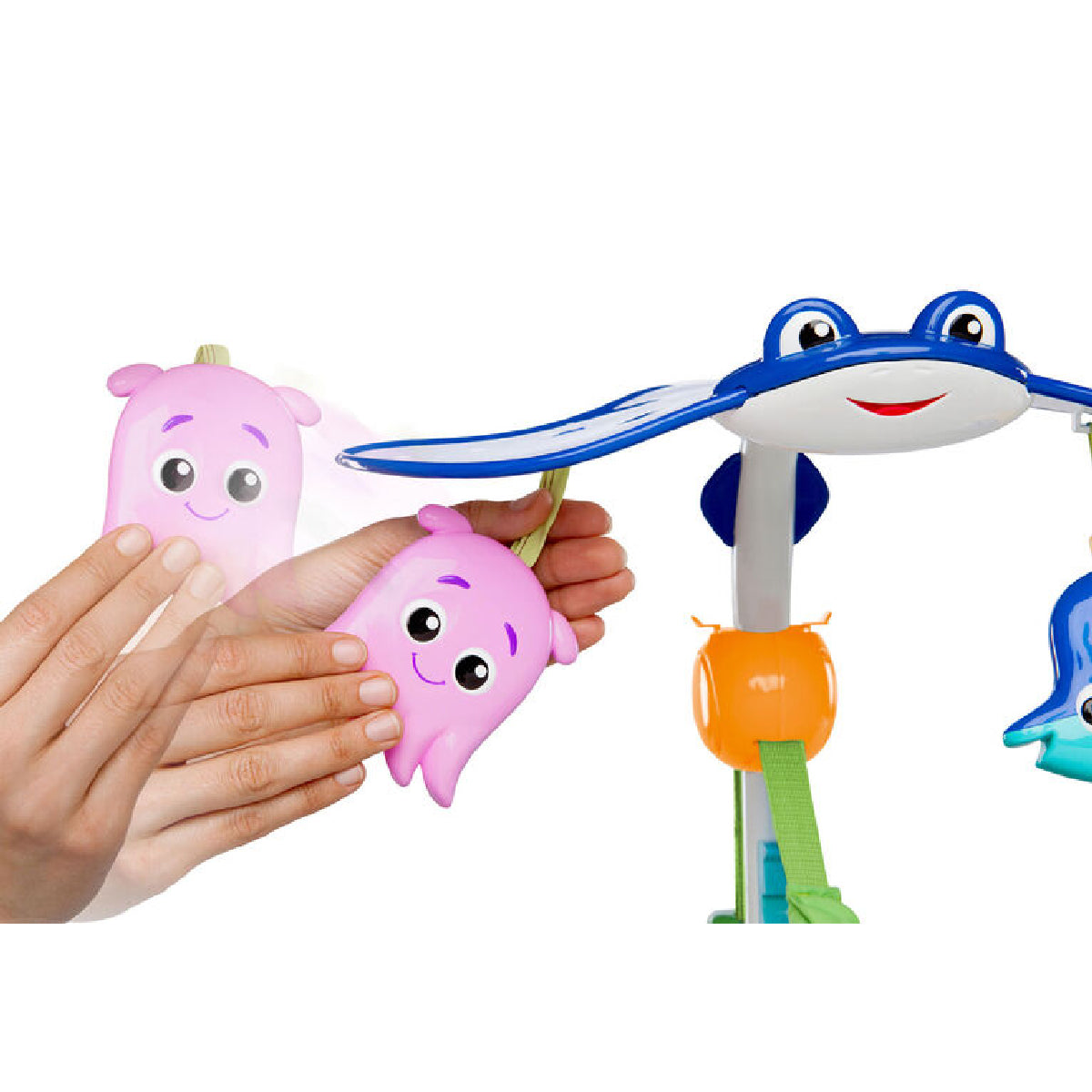 Colorful toy figures, including a pink one held by a hand, on a white background