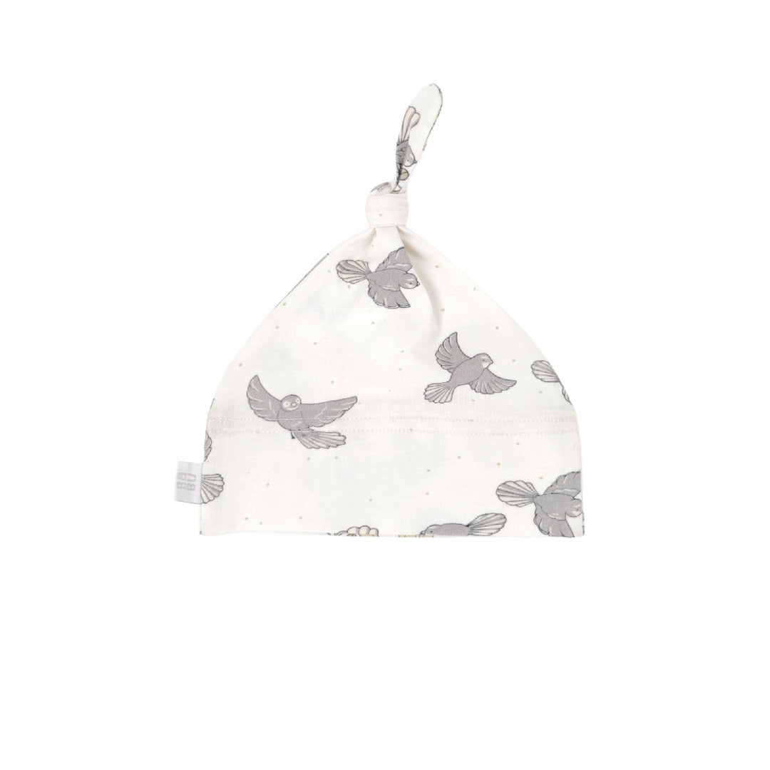 White baby hat with gray bird pattern on a white background