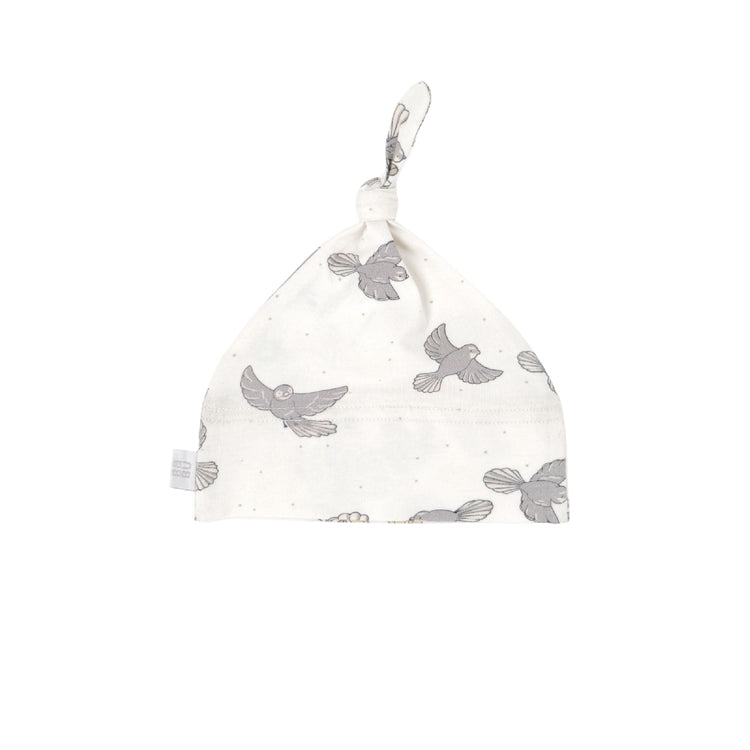 White baby hat with gray bird pattern on a white background