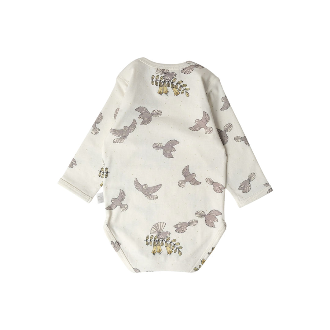 Baby onesie with bird pattern on a white background