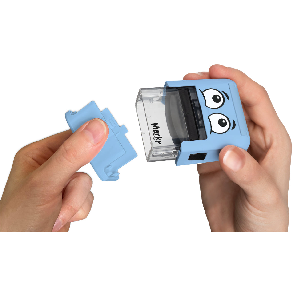 Blue sharpener with cartoon face design held by hands on a white background