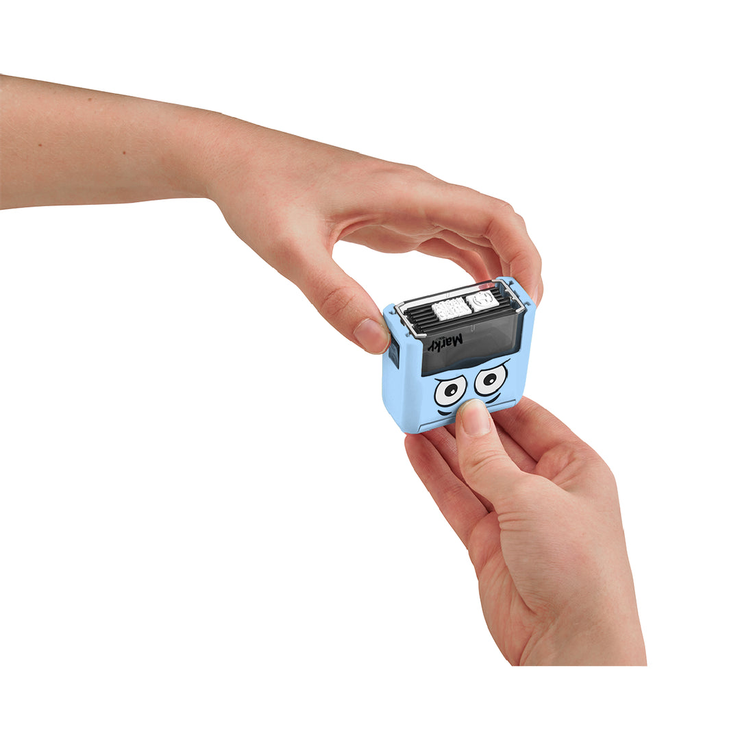 Small blue device with cartoon face held by a hand on a white background