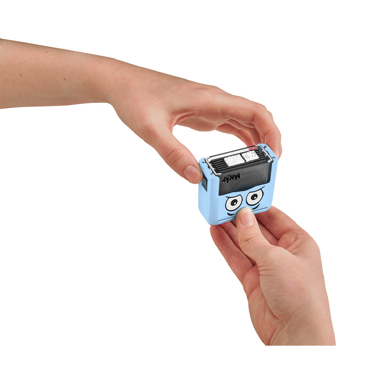 Small blue device with cartoon face held by a hand on a white background
