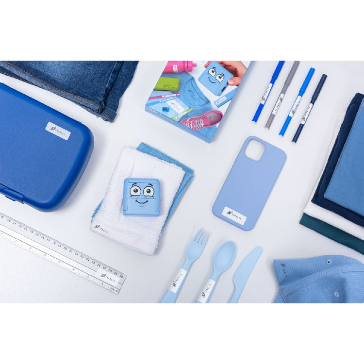 Collection of blue stationery items including a lunch box, utensils, and notebooks on a white background.