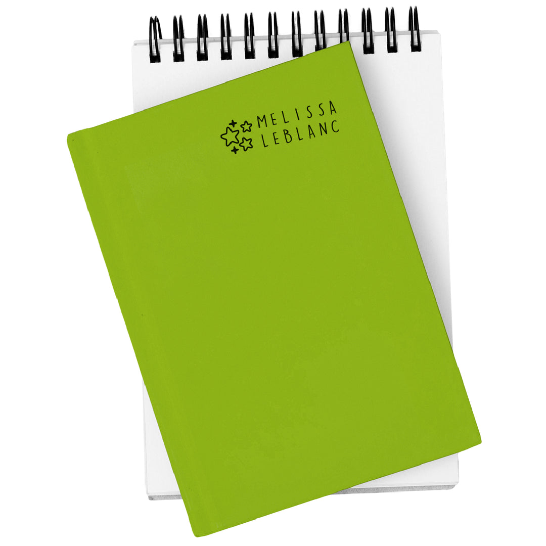 Green notebook with 'Melissa LeBlanc' branding on a white background