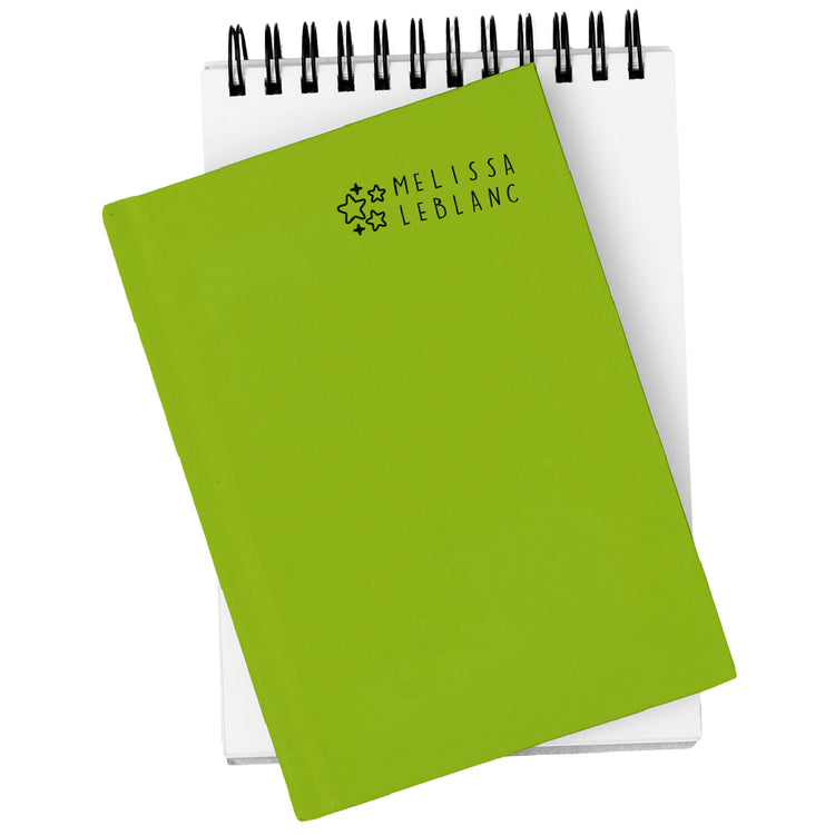 Green notebook with 'Melissa LeBlanc' branding on a white background