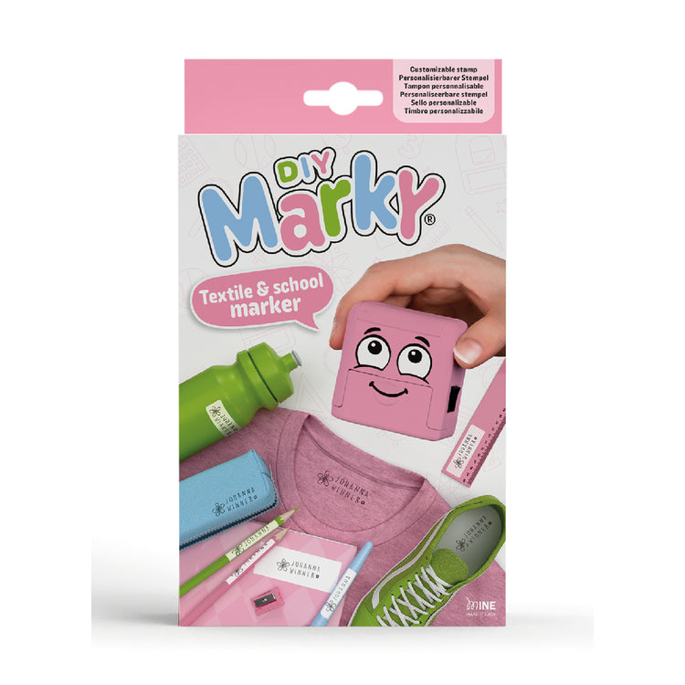 Packaging of DIY Marky textile and school marker with a pink marker and accessories on a white background.