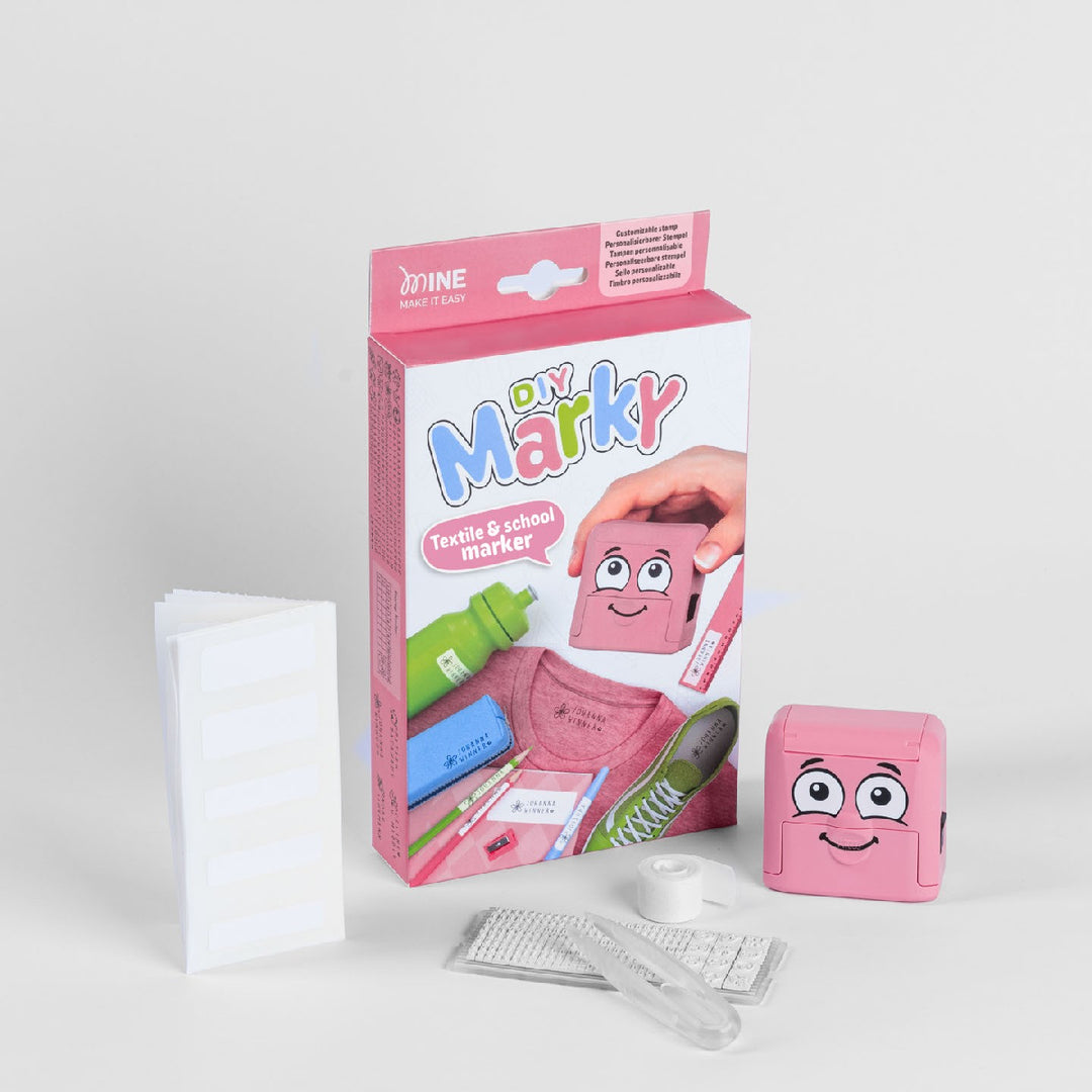 Pink 'DIY Marky' textile and school marker kit with packaging and accessories on a white background