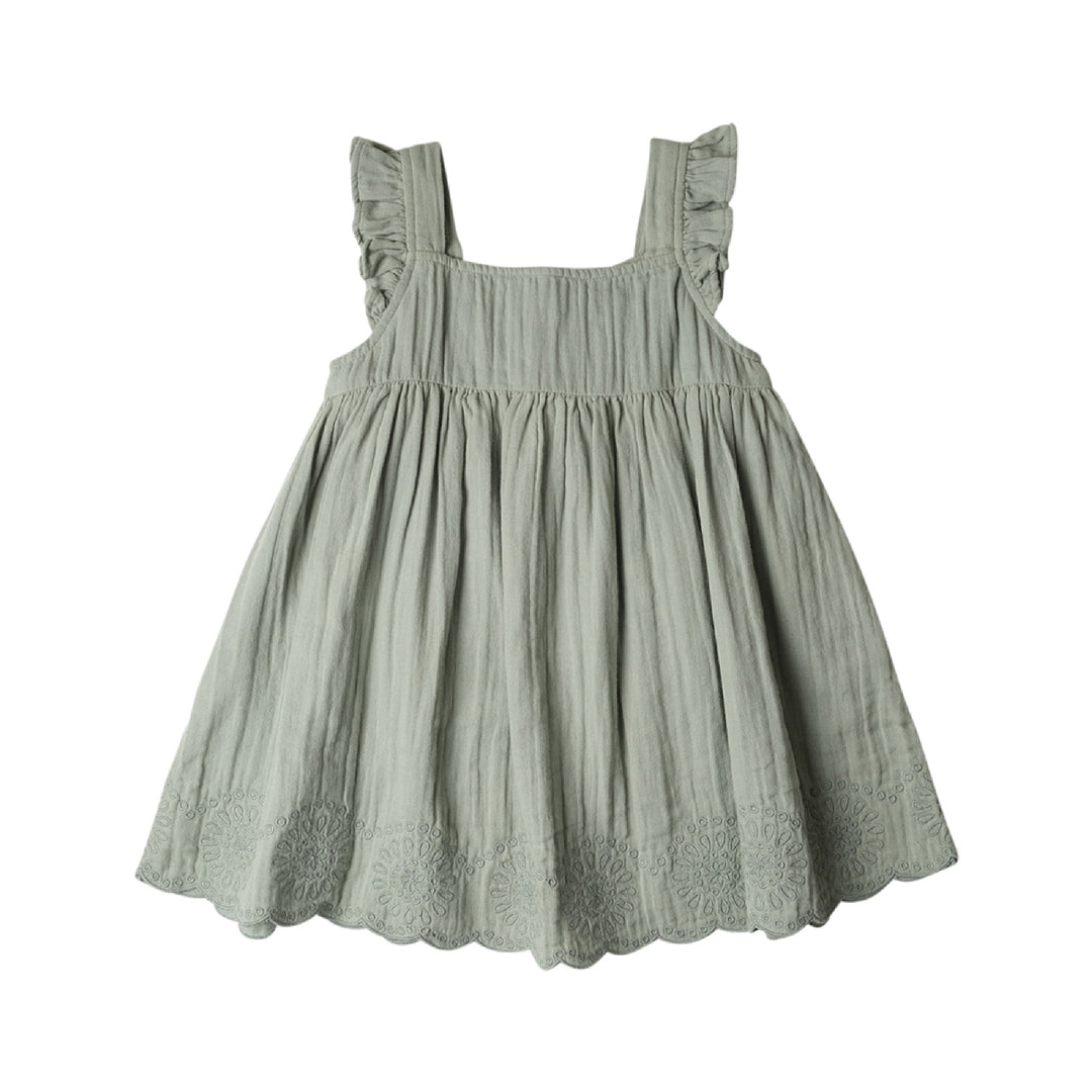 Green dress with ruffled straps on a white background