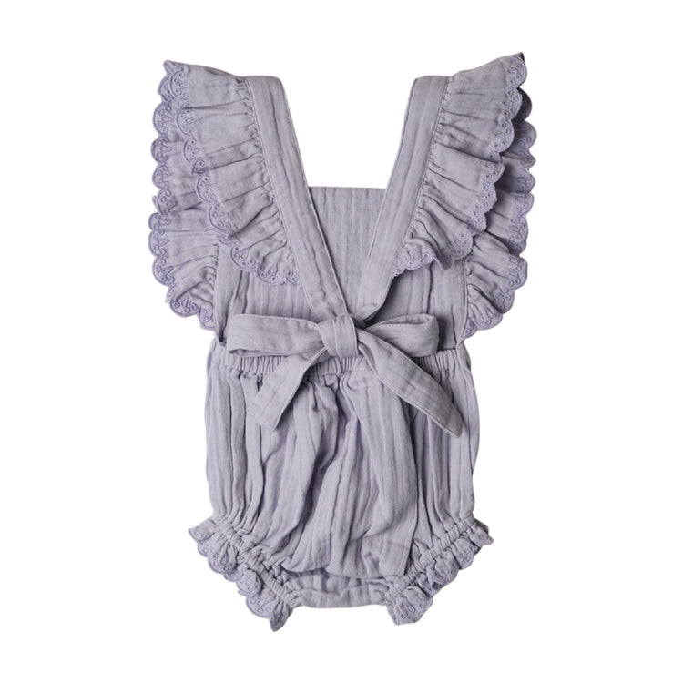 Gray baby romper with ruffled details on a white background