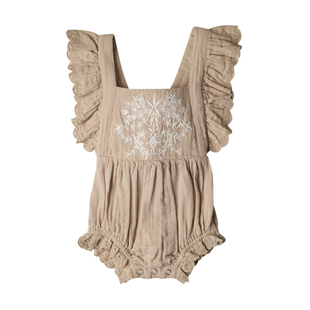 Beige romper with floral embroidery on a white background