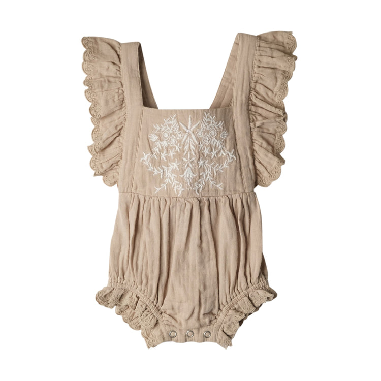 Beige romper with floral embroidery on a white background