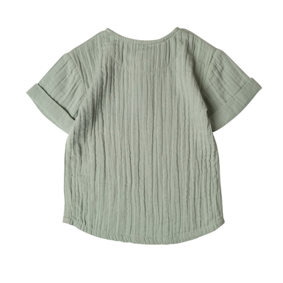 Light green textured shirt on a white background