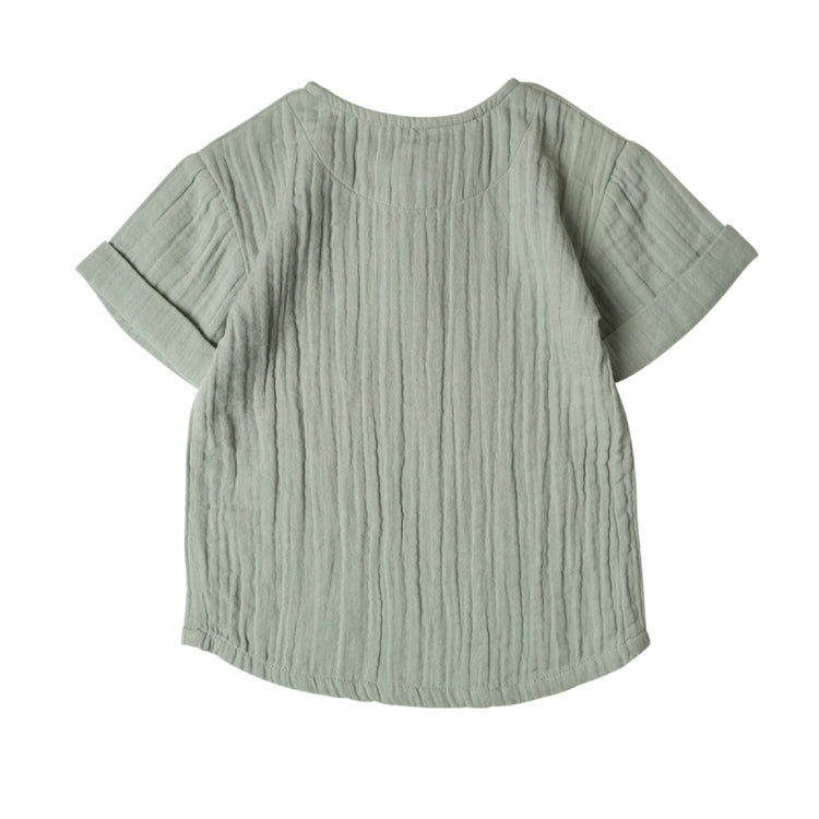 Light green textured shirt on a white background