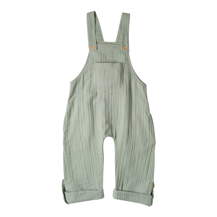 Green ribbed overalls on a white background
