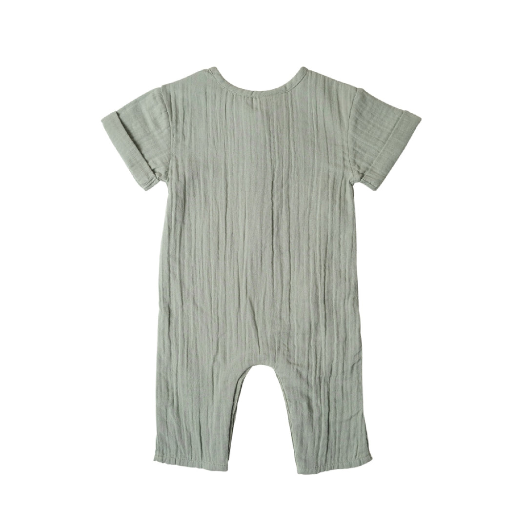 Green baby romper on a white background