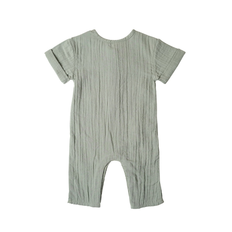 Green baby romper on a white background