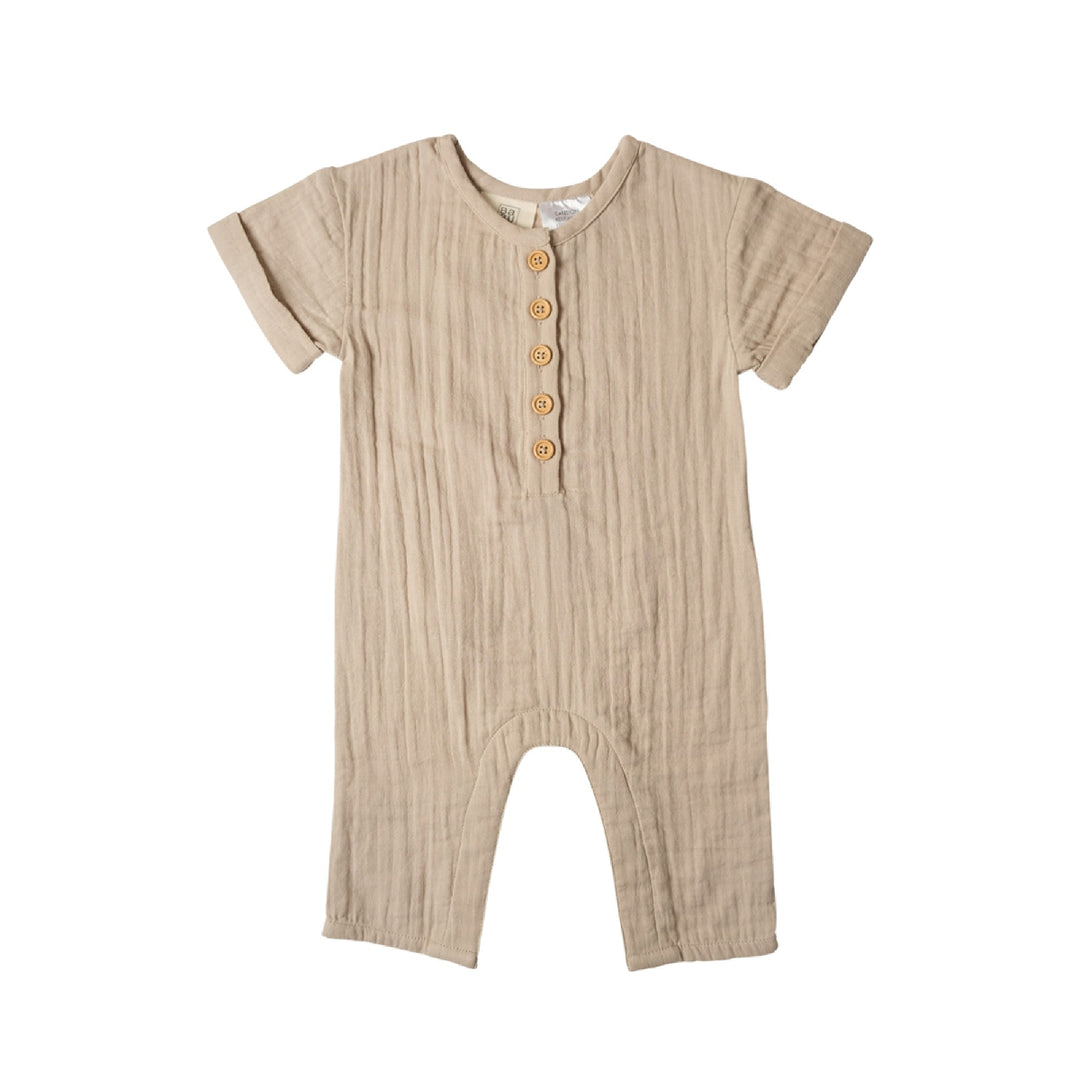 Beige baby romper with button details on a white background