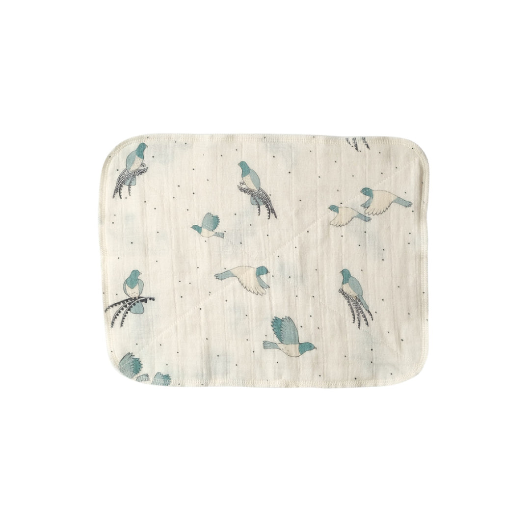 Baby blanket with bird pattern on a white background