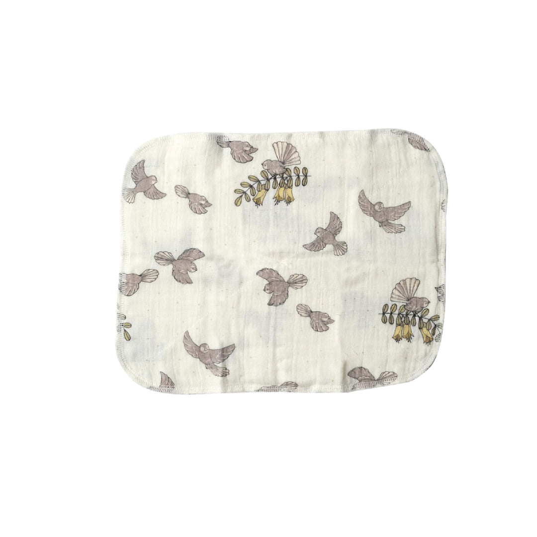 Muslin cloth with bird pattern on a white background