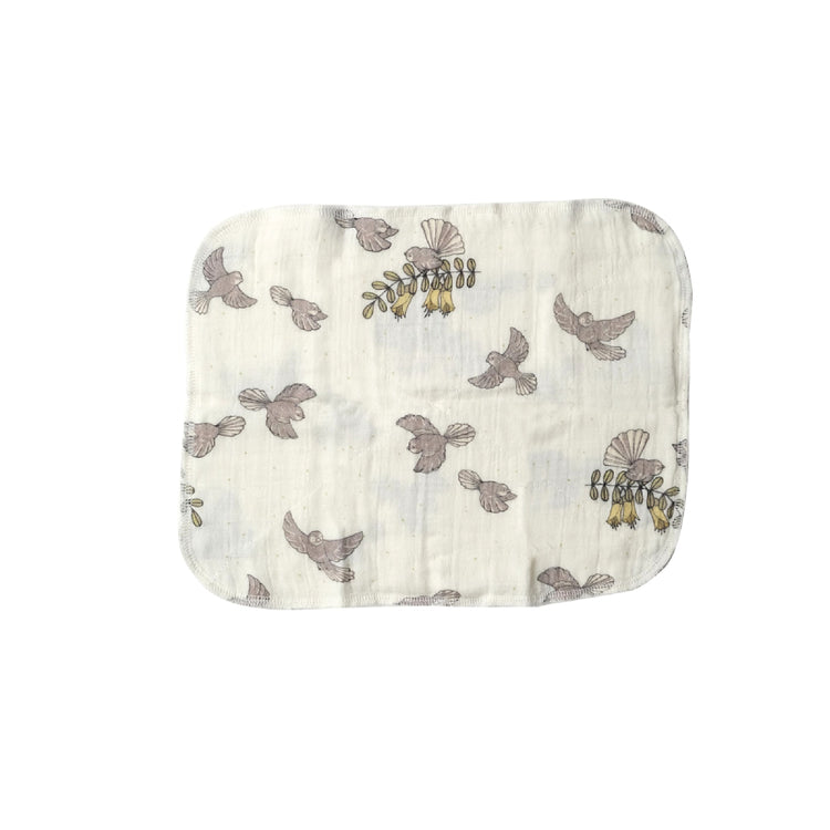 Muslin cloth with bird pattern on a white background