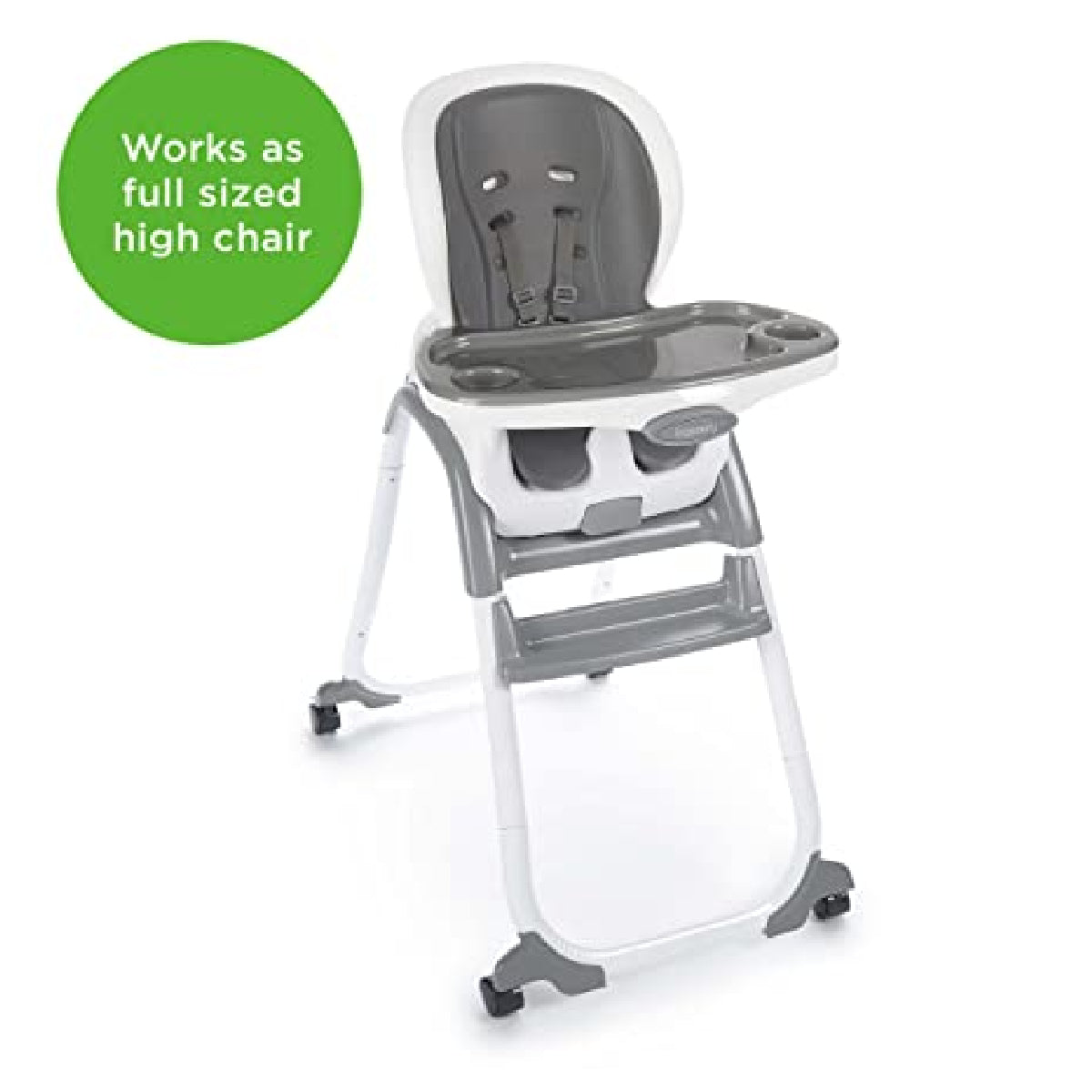 Gray and white high chair with a green label indicating it works as a full-sized high chair.