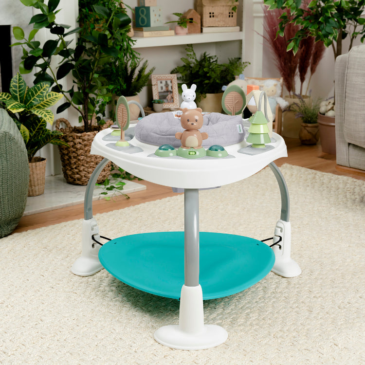 Baby activity center with toys in a home setting