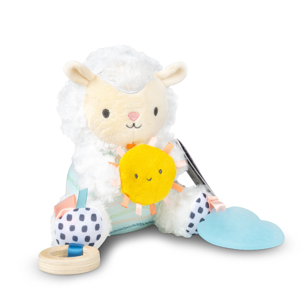 Plush toy sheep with a sun and polka dot elements on a white background
