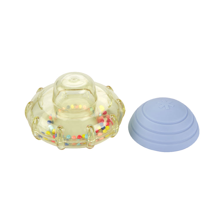 Clear plastic object with colorful beads and a blue spherical object on a white background