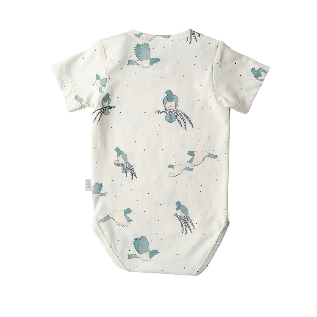 Baby onesie with bird pattern on a white background