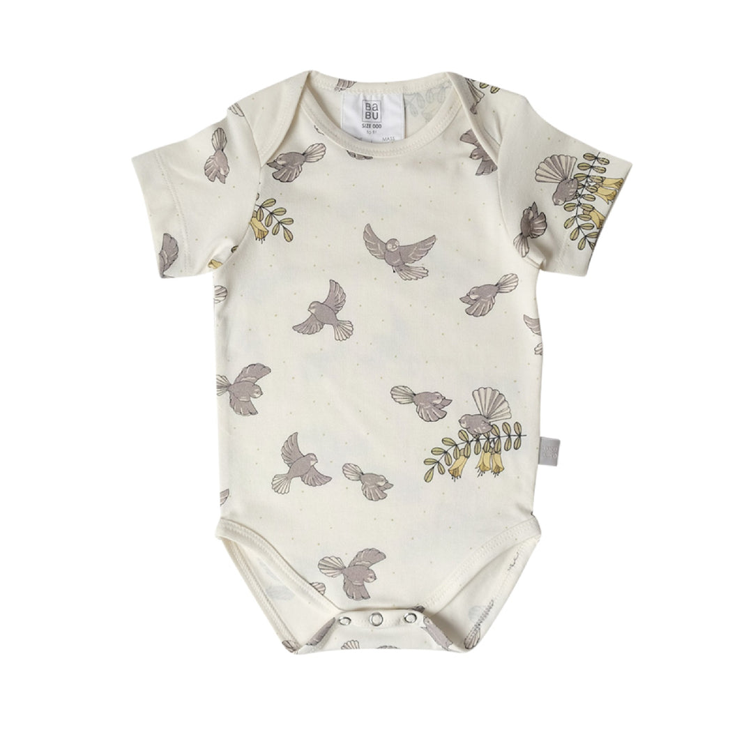 Baby onesie with bird pattern on a white background