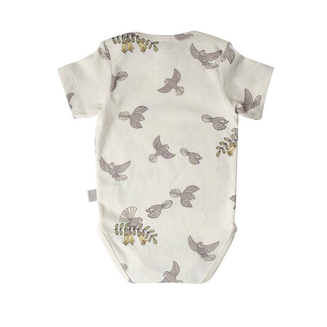 Baby onesie with bird pattern on a white background