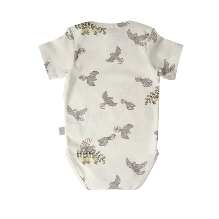 Baby onesie with bird pattern on a white background
