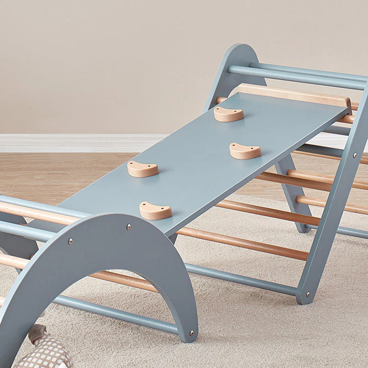 Children's wooden climbing toy with blue and brown colors on a neutral background