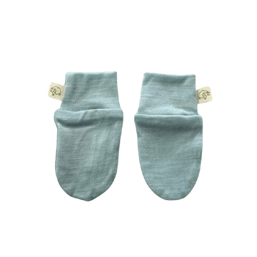 Pair of light blue baby socks on a white background