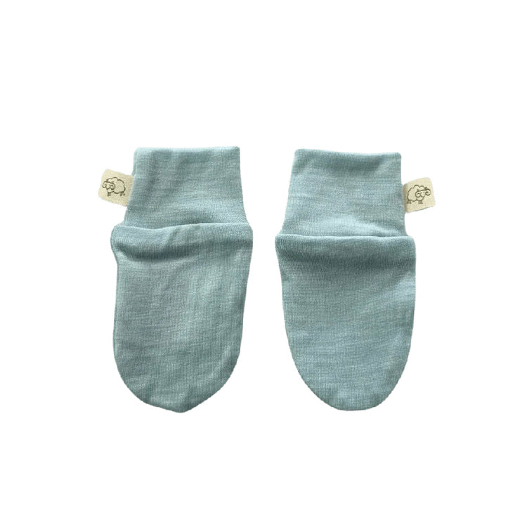 Pair of light blue baby socks on a white background