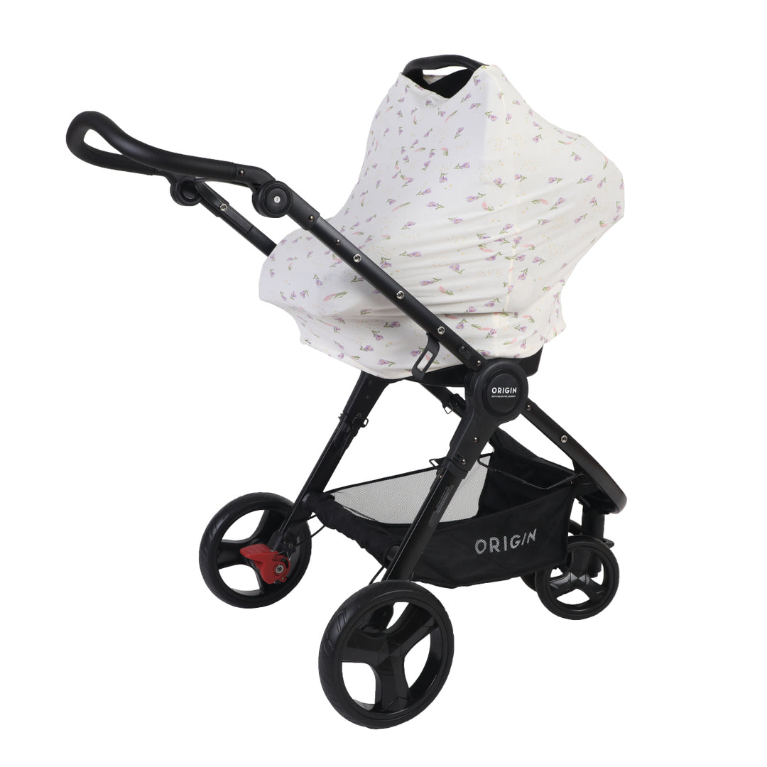 Black baby stroller with a white cover on a white background